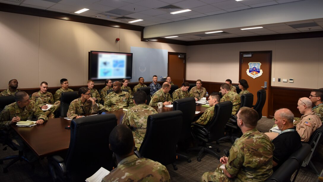 Canadian Brig. Gen. Alex Day, Air Forces Central Command Combined Air and Space Operations Center director, meets with senior CAOC leaders at Al Udeid Air Base, Qatar, Oct. 28, 2019.