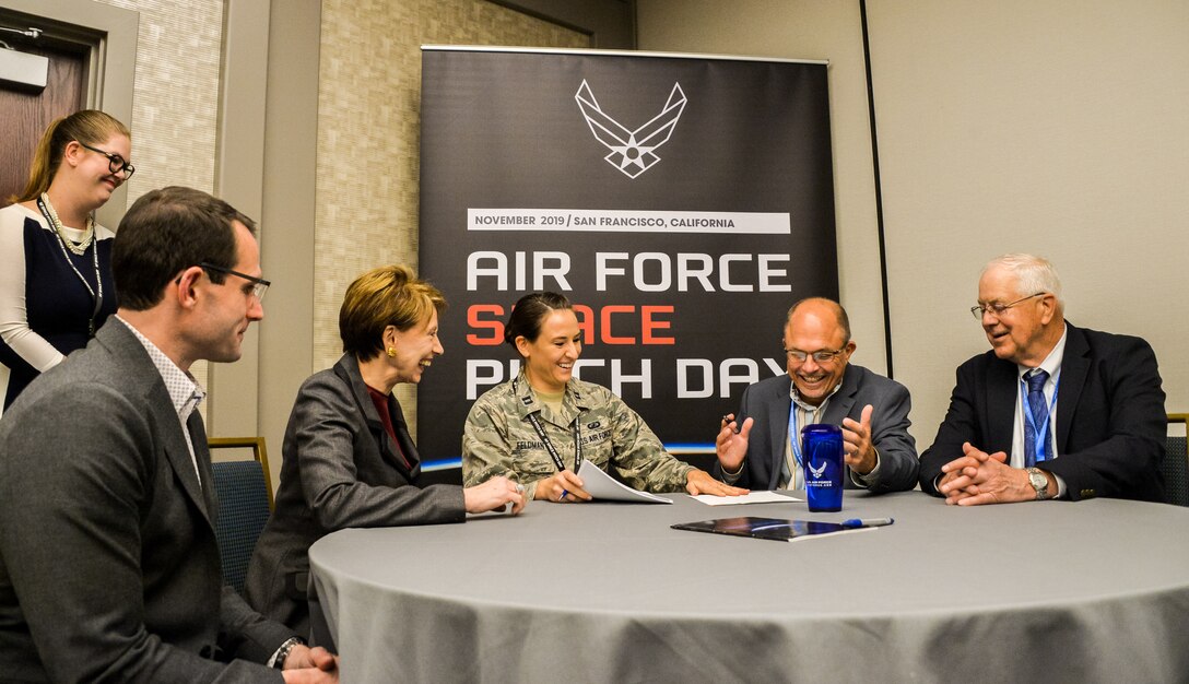 Dr. William Roper, Assistant Secretary of the Air Force for Acquisition, and Secretary of the Air Force Barbara Barrett witness the first contract signing of Air Force Space Pitch Day, Nov. 5, 2019, San Francisco, Calif. Air Force Space Pitch Day is a two-day event hosted by the Air Force to demonstrate the Air Force’s willingness and ability to work with non-traditional startups. (U.S. Air Force photo by Van De Ha)