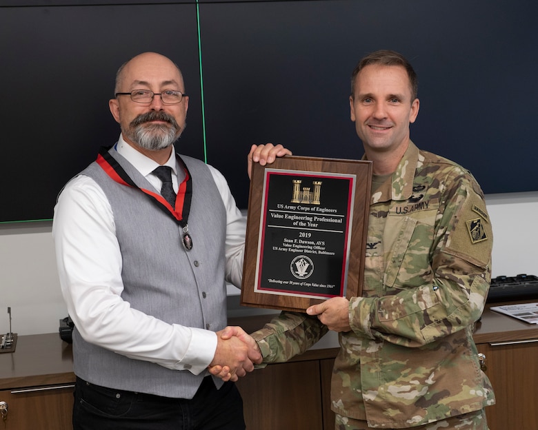 Col. John Litz, Baltimore District commander, presents Sean Dawson, Baltimore District value engineer, with the U.S. Army Corps of Engineers 2019 Value Engineer Professional of the Year award at the Baltimore District headquarters, Sept. 11, 2019. (U.S. Army photo by John Sokolowski)