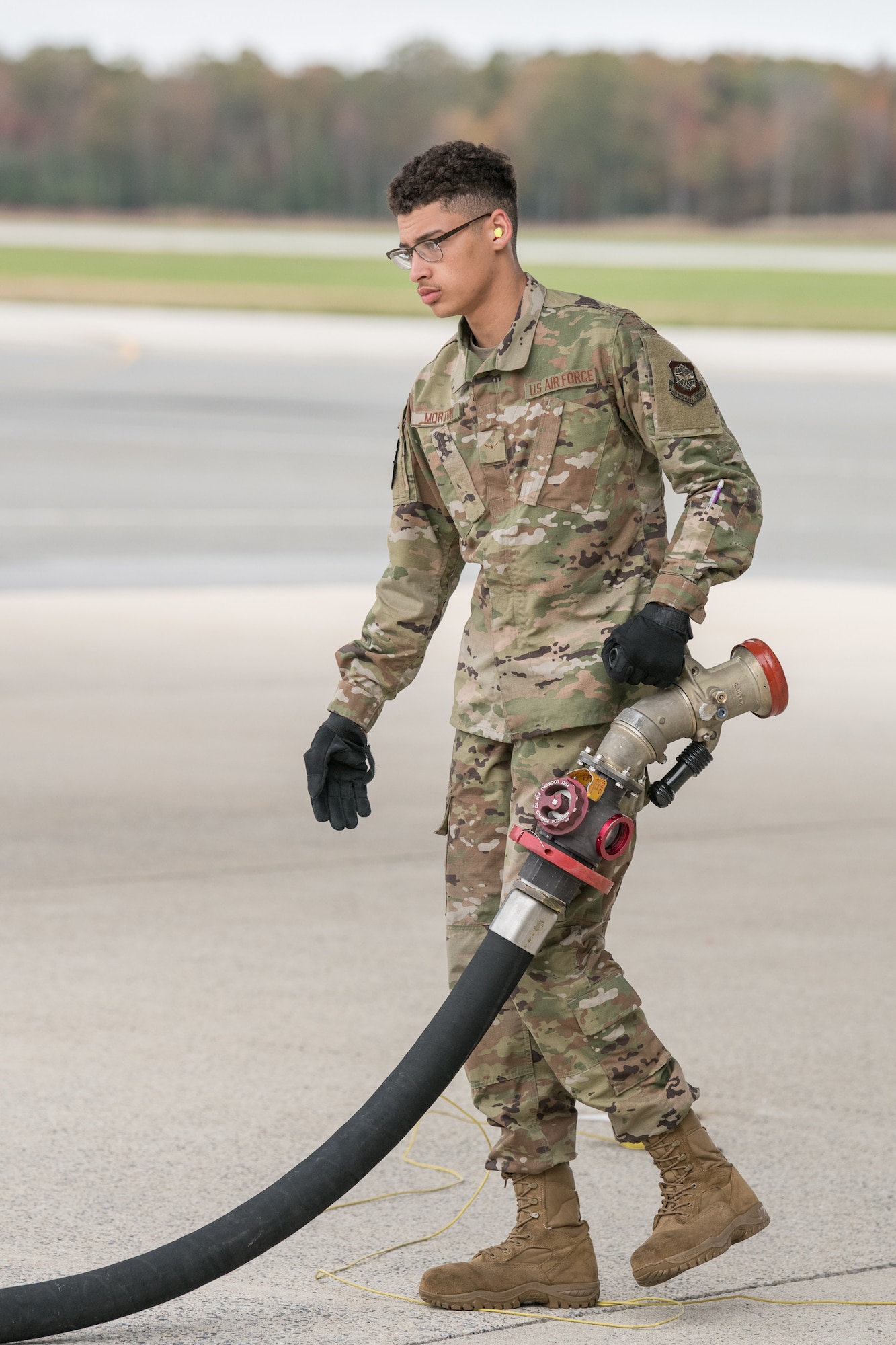 Airman Michael Morton, 436th Logistics Readiness Squadron fuels distribution operator, disconnects a fuel hose from a C-5 Galaxy after refueling is complete, Oct. 29, 2019, at Dover Air Force Base, Del. Refueling can last anywhere from a few minutes to a few hours. (U.S. Air Force photo by Mauricio Campino)