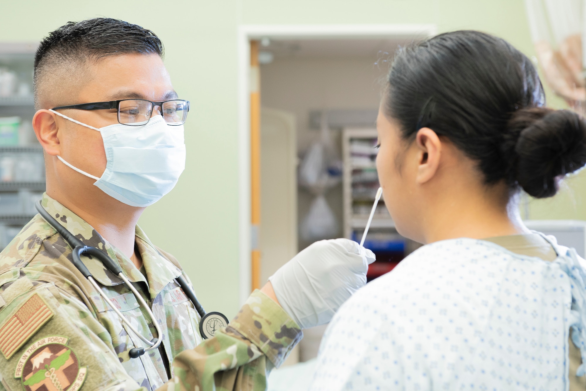 Capt. Rupert Laco, 374th Medical Operations Squadron emergency services flight commander, administers a rapid flu test to a patient, Nov. 4, 2019, at Yokota Air Base, Japan.
