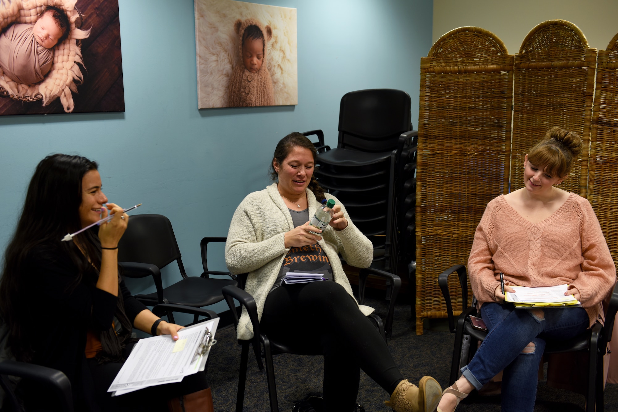Patients and participants converse before the Village Friends Group Obstetrics Care program begins at Royal Air Force Lakenheath, England, Oct. 25, 2019. The program was created to provide more patient involvement, education, empowerment and socialization. (U.S. Air Force photo by Airman 1st Class Rhonda Smith)