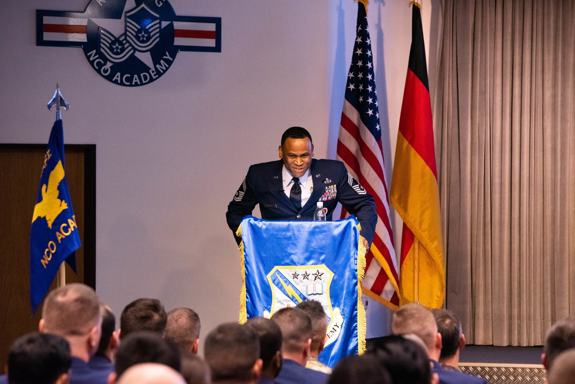 U.S. Air Force Chief Master Sgt. Terrance Smiley, Kisling Noncommissioned Officer Academy commandant, addresses attendees during a ribbon cutting event for the reopening of the NCOA on Kapaun Air Station, Germany, Nov. 1, 2019. Kisling NCOA was closed for six months to complete renovations in order to improve the educational environment for students and instructors. (Courtesy Photo)