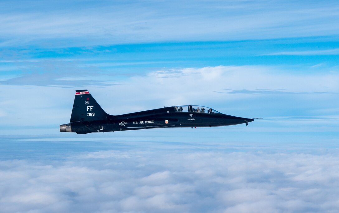 A U.S. Air Force T-38 Talons from the 1st Fighter Wing flies over the Atlantic Ocean during training off the coast of Virginia, Oct. 30, 2019. The 1st Fighter Wing is home to the 94th Fighter Squadron, 27th Fighter Squadron and the 71st Fighter Training Squadron at Joint Base Langley-Eustis, Va. (U.S. Air Force Photo by Tech Sgt. Carlin Leslie)(Released)