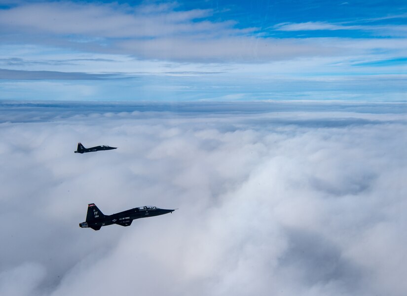 U.S. Air Force T-38 Talons from the 1st Fighter Wing fly in formation of the Atlantic Ocean during training off the coast of Virginia, Oct. 30, 2019. The 1st Fighter Wing is home to the 94th Fighter Squadron, 27th Fighter Squadron and the 71st Fighter Training Squadron at Joint Base Langley-Eustis, Va. (U.S. Air Force Photo by Tech Sgt. Carlin Leslie)(Released)