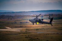 An AH-64 from Charlie Company, 1-3rd Attack Reconnaissance Battalion fires a rocket during live fire training at Grafenwoehr training area.