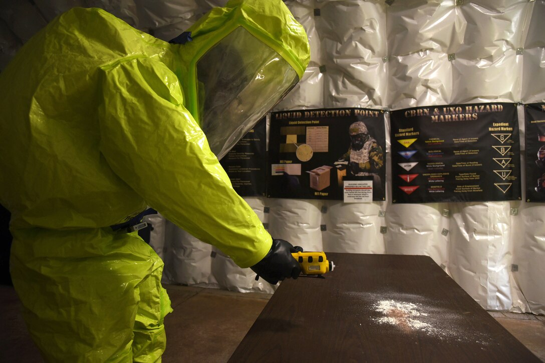 An image of an Airman conducting air sampling of an agent during a CBRNE exercise