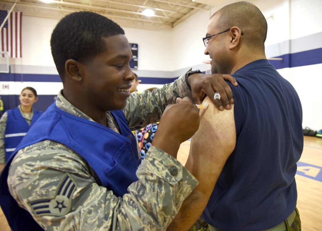 An image of an Airman administering the flu shot during the disease containment plan portion of the exercise