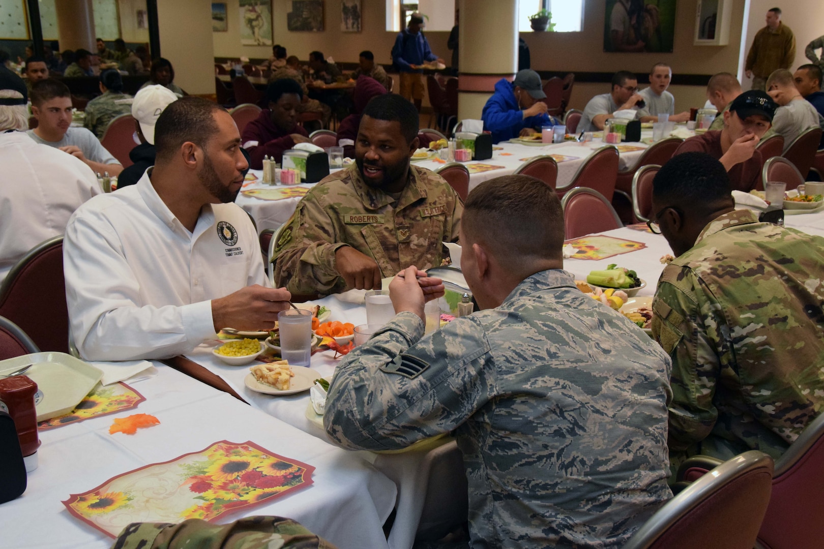 Bexar County Commissioner Tommy Calvert, Precinct 4, fellowships with 433rd Airlift Wing Reserve Citizen Airmen after serving the Airmen a Thanksgiving feast, at the Live Oak Dining Facility, Joint Base San Antonio-Lackland, Texas Nov. 2, 2019.