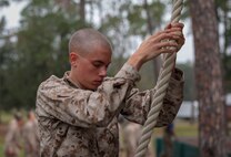 A recruit with Lima Company, 3rd Recruit Training Battalion, decends a rope on the Confidence Course on Marine Corps Recruit Depot Parris Island, S.C. Oct. 30, 2019. The Confidence Course is composed of various obstacles that both physically and mentally challenge recruits. (U.S. Marine Corps photo by Pfc. Michelle Brudnicki)