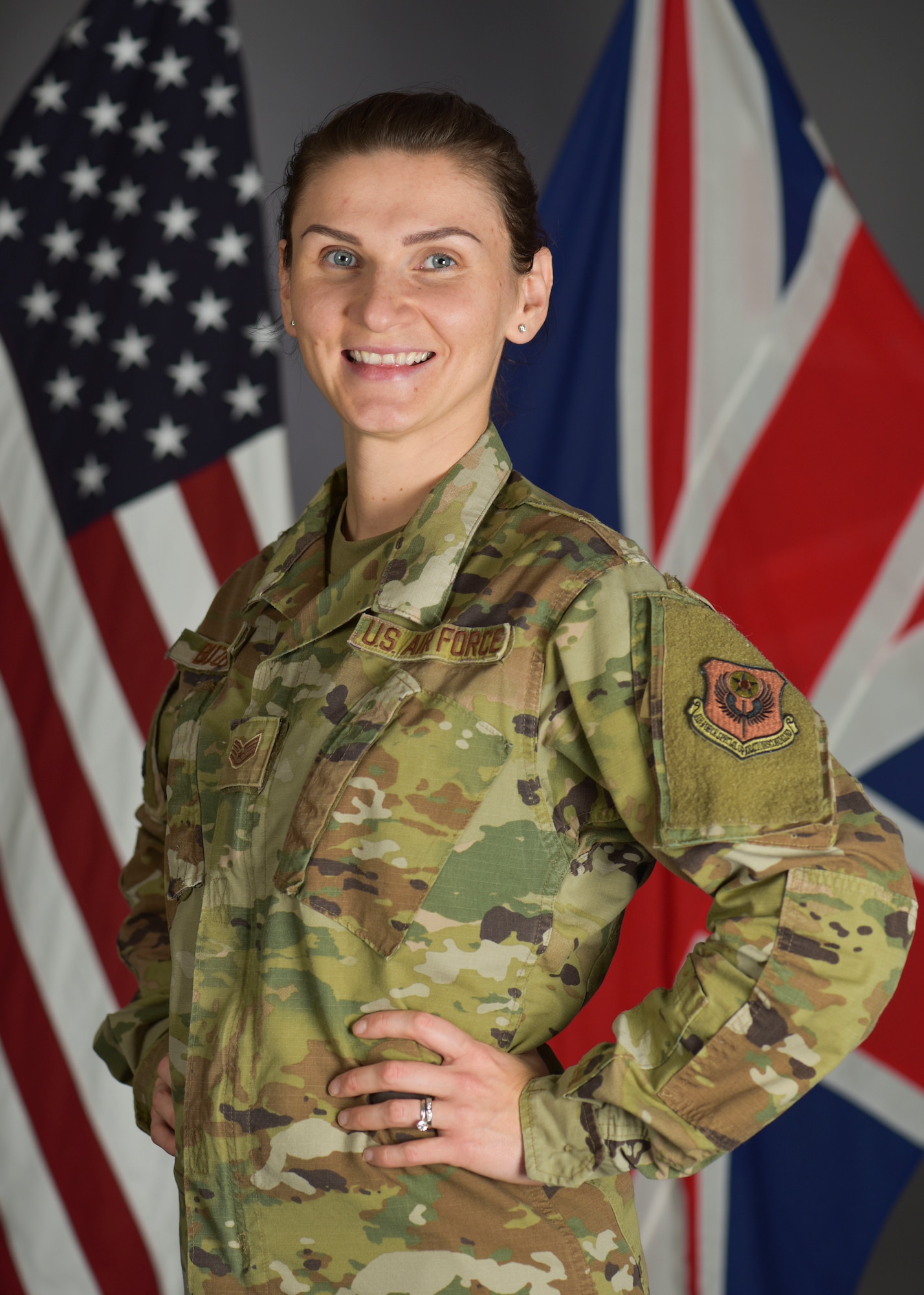 U.S. Air Force Staff Sgt. Olga Buzhak, 352nd Special Operations Wing financial analyst, poses for a picture at RAF Mildenhall, England, Oct.27,2019. Buzhak traveled from her birth place of Minsk, Belarus to New York City at 19 with a few hundred dollars – to create a new life and joining the U.S. Air Force. (U.S. Air Force photo by Senior Airman Alexandria Lee)