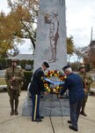 Retired Brig. Gen. Patrick Alesia, president of the 42nd Rainbow Division Association, joins Staff Sgt. Colin Stewart, a Soldier in the New York Army National Guard's 1st Battalion, 69th Infantry, in placing a wreath at the 42nd Infantry Division memorial in Garden City, N.Y., on Nov. 8, 2018. The monument marks the location of Camp Mills, where the 42nd Division, now a part of the New York National Guard, was organized in 1917. A wreath will be placed at the monument once again on Nov. 9, 2019.