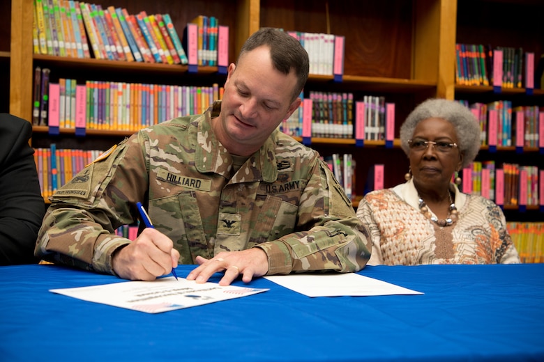 U.S. Army Corps of Engineers Vicksburg District Commander Col. Robert A. Hilliard signs an adoption certificate Nov. 4 Beechwood Elementary School in Vicksburg, Mississippi, securing a partnership with the school and the district for the 2019-2020 school year.