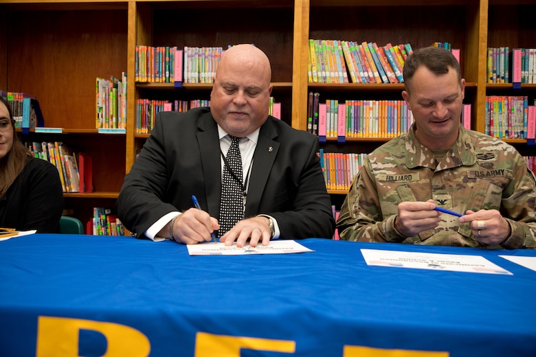 U.S. Army Corps of Engineers Vicksburg (USACE) District Commander Col. Robert A. Hilliard and Beechwood Elementary School principal David Adams sign an adoption certificate Nov. 4 Beechwood Elementary School in Vicksburg, Mississippi, securing the 2019-2020 Adopt-A-School partnership between the district and the school.