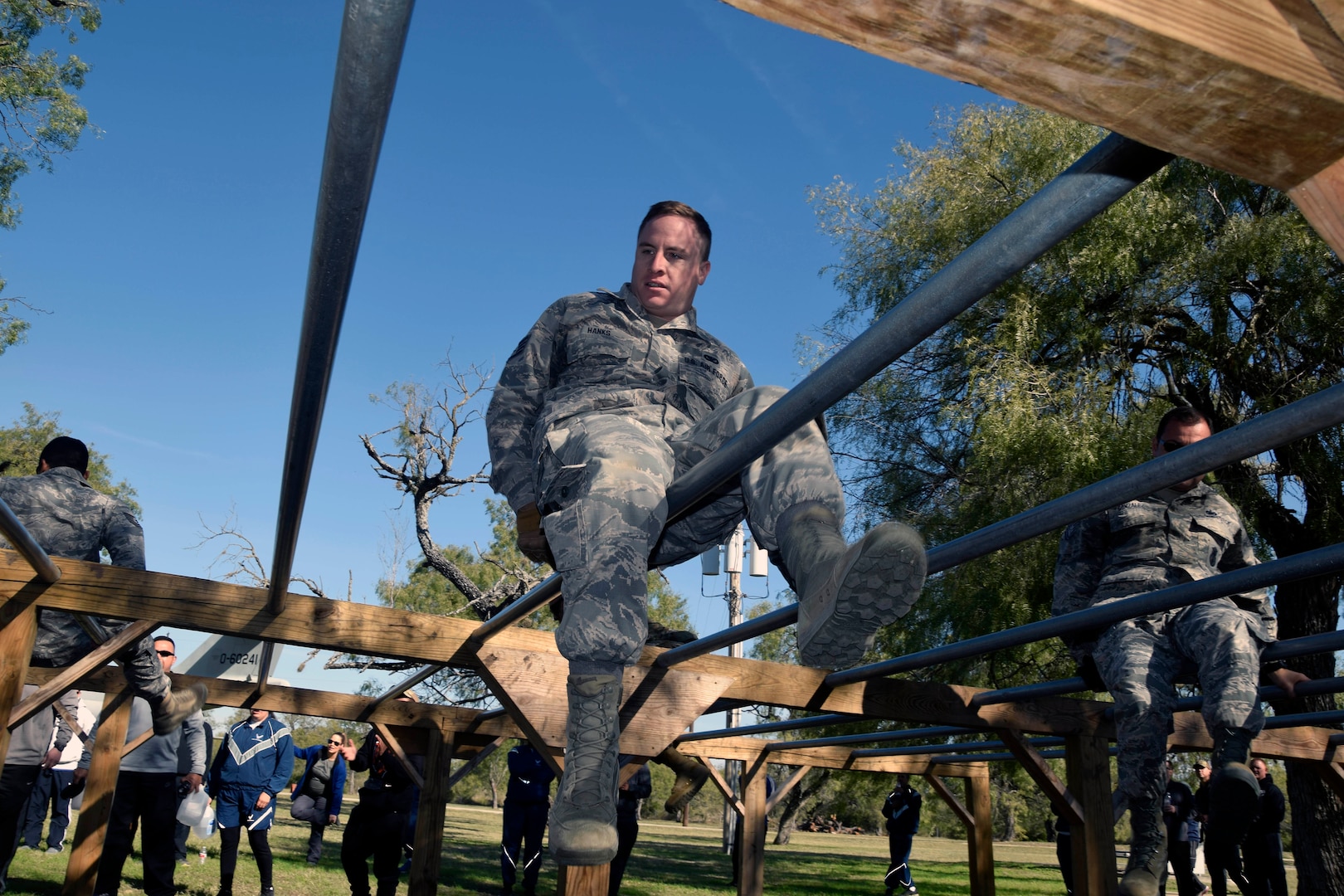 Staff Sgt. Bradley A. Hanks, 433rd Security Forces Squadron, crawls across an obstacle during a team-building exercise at the 433rd AW Resilience Tactical Pause at the Air Force Basic Military Training’s Basic Expeditionary Airman Skills Training site at the Medina Annex, Joint Base San Antonio-Lackland, Texas Nov. 3, 2019.