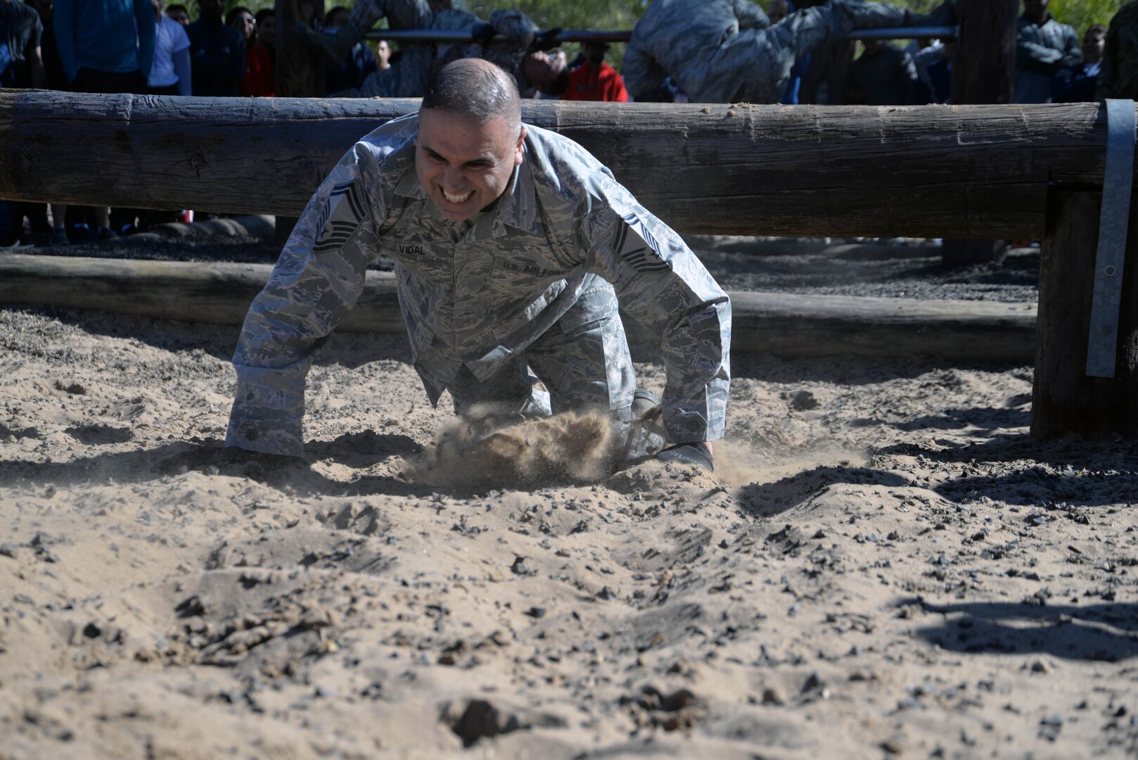 Senior Master Sgt. Leonard E. Vidal, 433rd Maintenance Group plans and schedule supervisor, high-crawls through sand during a team-building exercise at the 433rd AW Resilience Tactical Pause at the Air Force Basic Military Training’s Basic Expeditionary Airman Skills Training site at the Medina Annex, Joint Base San Antonio-Lackland, Texas Nov. 3, 2019.