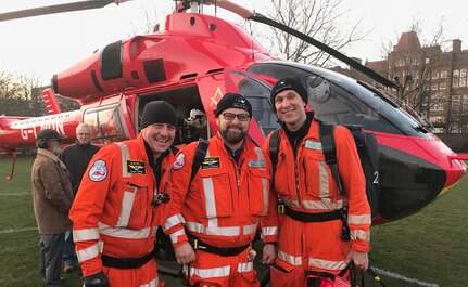Maj. Ryan Newberry (right), U.S. Army Medical Corps emergency and pre-hospital physician assigned to the U.S. Army Institute of Surgical Research at Joint Base San Antonio-Fort Sam Houston, stands next to Dr. Gareth Davies (left), London’s Air Ambulance medical director, and Richard Kingham, London’s Air Ambulance flight paramedic (center) after coming back from a call to treat a trauma patient. Newberry served for six months in 2018 as a flight physician for London’s Air Ambulance, which is regarded as one of the top helicopter emergency medical services in the world, as part of a military exchange program between Great Britain and the U.S.