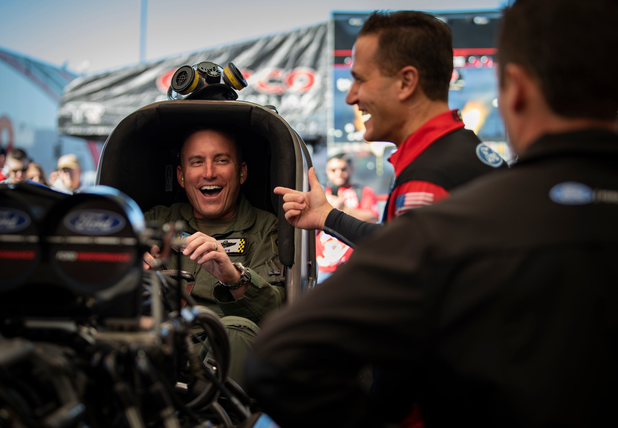 Gen. Novotny and Bob Tasca III laugh together.