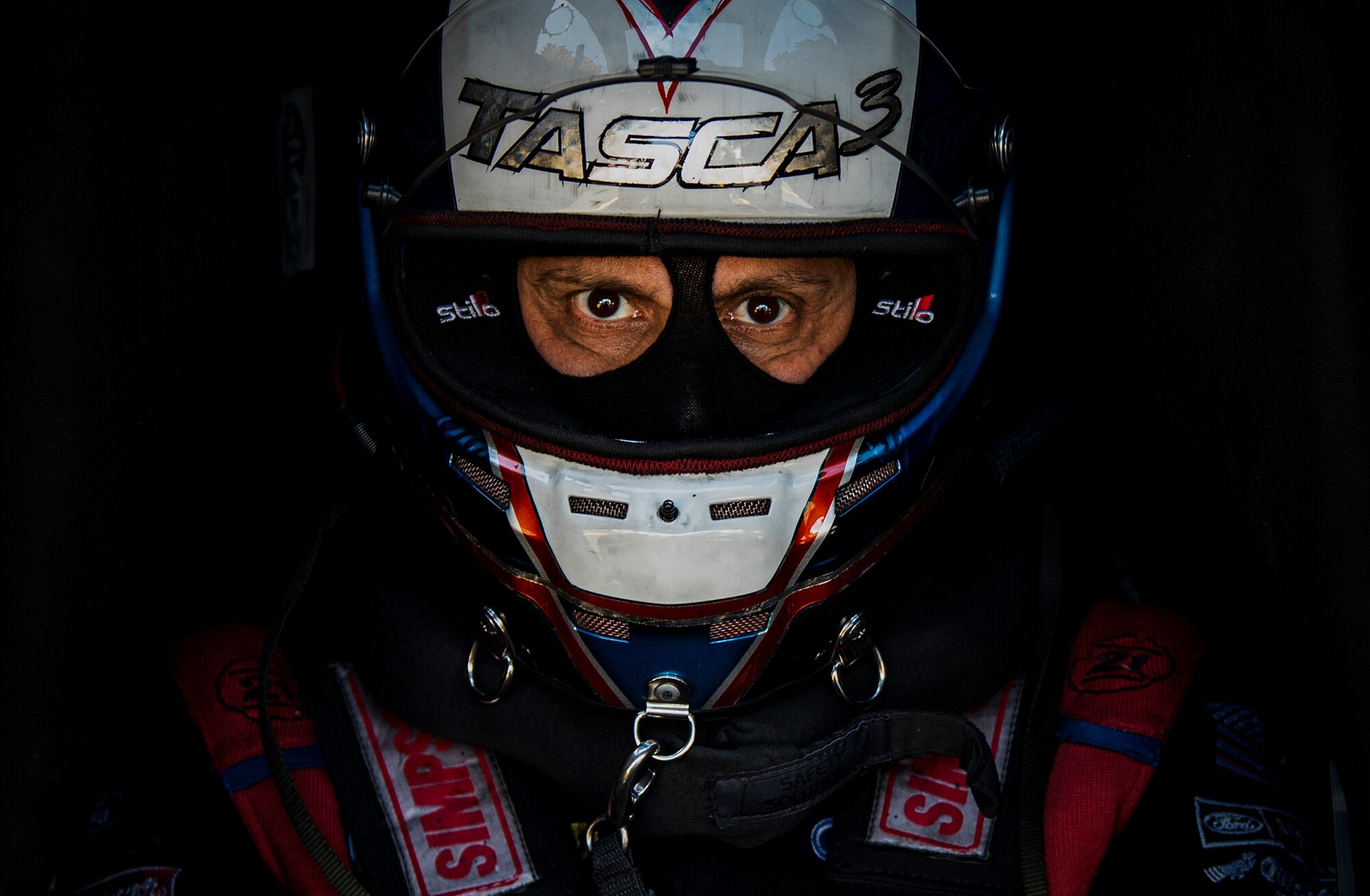 Bob Tasca III sits in his race car.