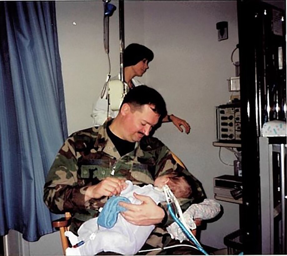 Col. Bryan Runion, 445th Mission Support Group commander, holds his baby girl, Ashlynn.