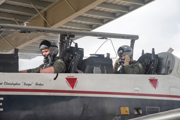 2nd Lt. Gordon Milne, 47th Student Squadron specialized undergraduate pilot training student, and Lt. Col. Gentry Mobley, 85th Flying Training Squadron commander, prepare for takeoff in a T-6 Texan II at Laughlin Air Force Base, Texas, Nov. 5, 2019. Over the last several years, sun shelters have been constructed to house many of the aircraft at Laughlin. (U.S. Air Force photo by Senior Airman Daniel Hambor)