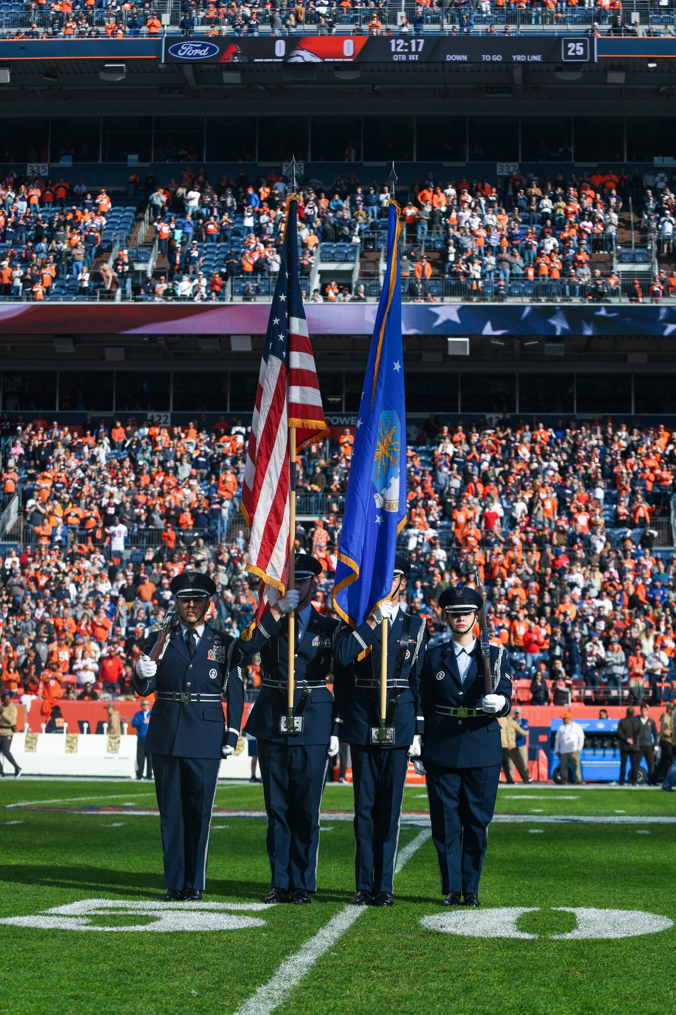 Buckley Air Force Base Mile High honor guardsmen prepare to present the colors before the Denver Broncos Salute to Service game at Empower Field at Mile High in Denver, Nov. 3, 2019.