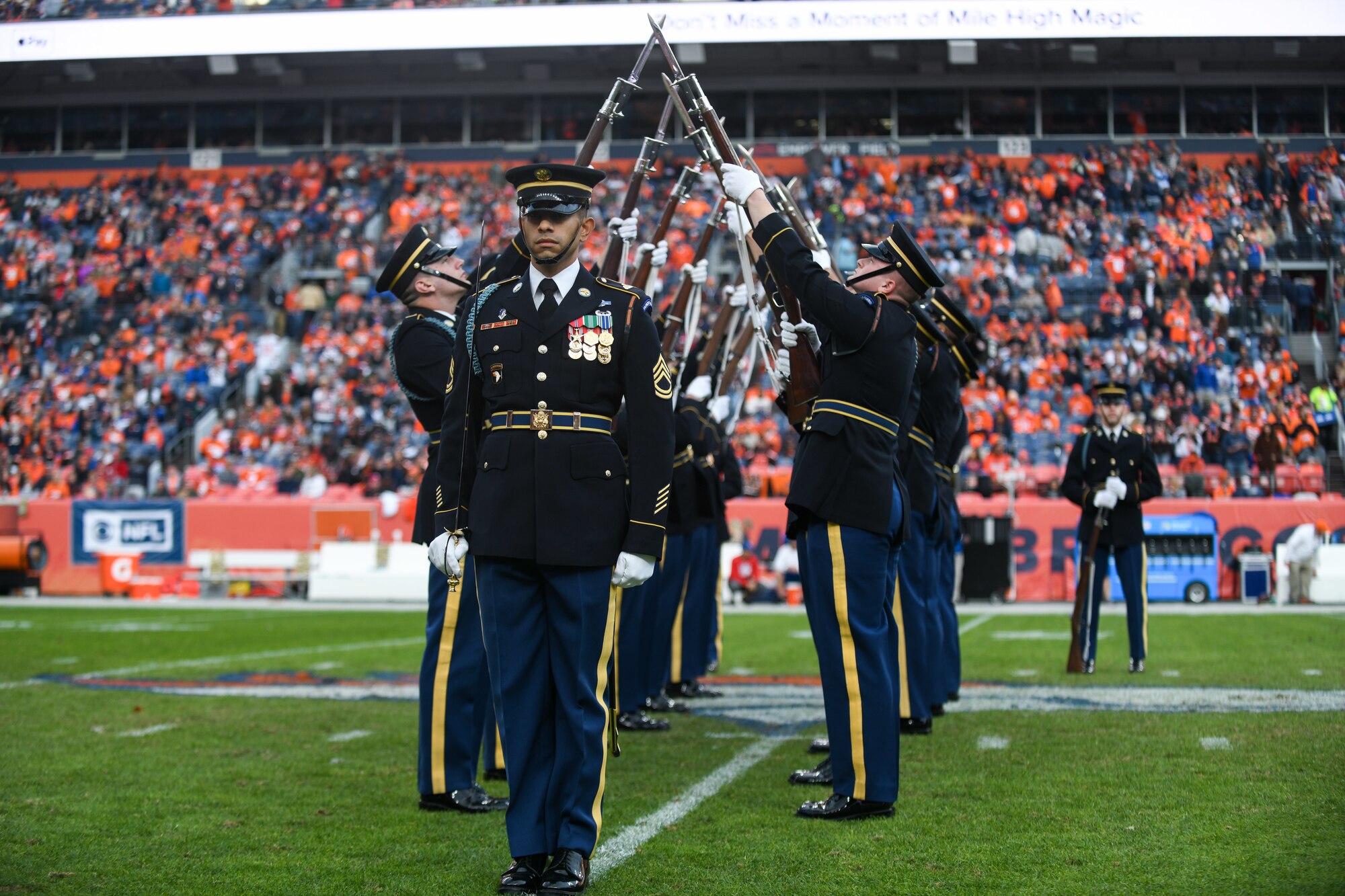 The U.S. Army Drill Team from Washington D.C.,performs during the halftime show for the Denver Broncos Salute to Service game, Nov. 3, 2019, at Empower Field in Mile High in Denver.
