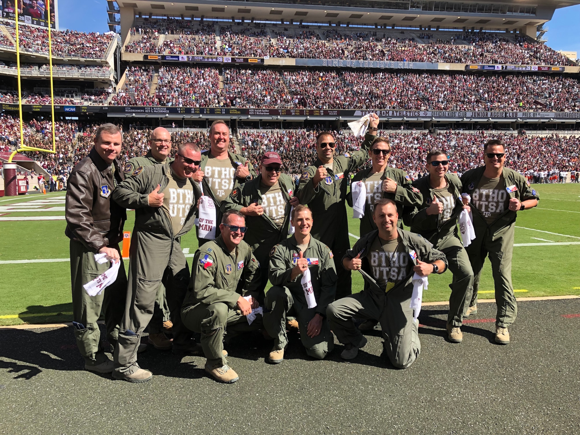 Air crews stands on Kyle Field during their recognition for the pregame flyover for Texas A&M.