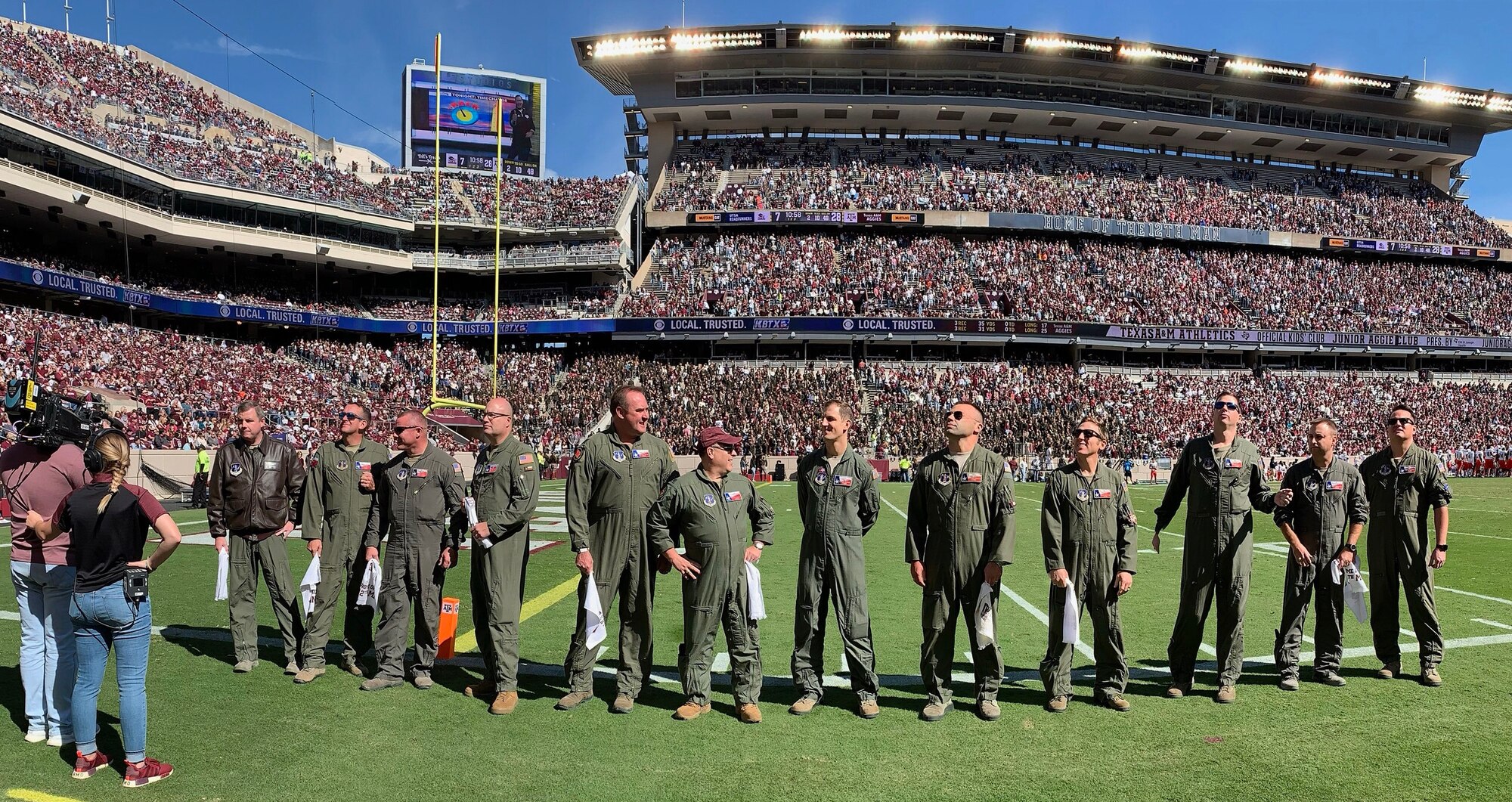 Air crews stands on Kyle Field during their recognition for the pregame flyover for Texas A&M.