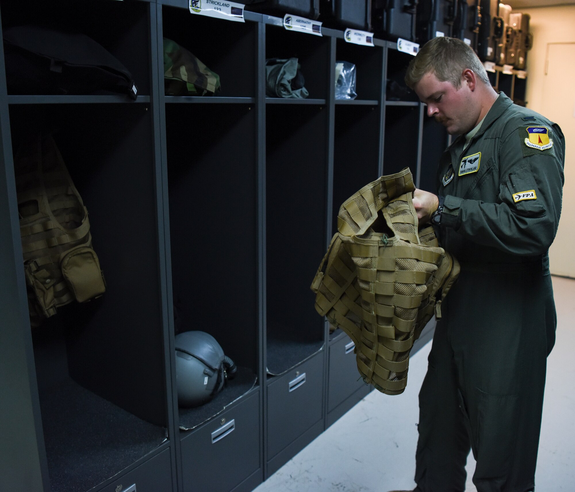 1st Lt. Sam Strickland, 69th Expeditionary Bomb Squadron electronic warfare officer, prepares to don an air save vest on Andersen Air Force Base, Guam, Oct. 22, 2019. Strickland, along with other 69th EBS aircrew Airmen, are deployed to Andersen to complete the Continuous Bomber Presence mission. The CBP builds trust with our allies by strengthening and maintaining peace in the Indo-Pacific, while advocating our ability to protect our allies interest as well as our own. (U.S. Air Force photo by Airman 1st Class Michael S. Murphy)