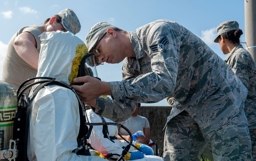 Airmen from the 18th Aerospace Medicine Squadron participated in a fuel spill exercise at Kadena Air Base, Japan, Oct. 25, 2019. During an exercise scenario, responders used the Airman's Manual, which helped them find the proper procedures to respond to the situation. (U.S. Air Force photo by Naoto Anazawa)