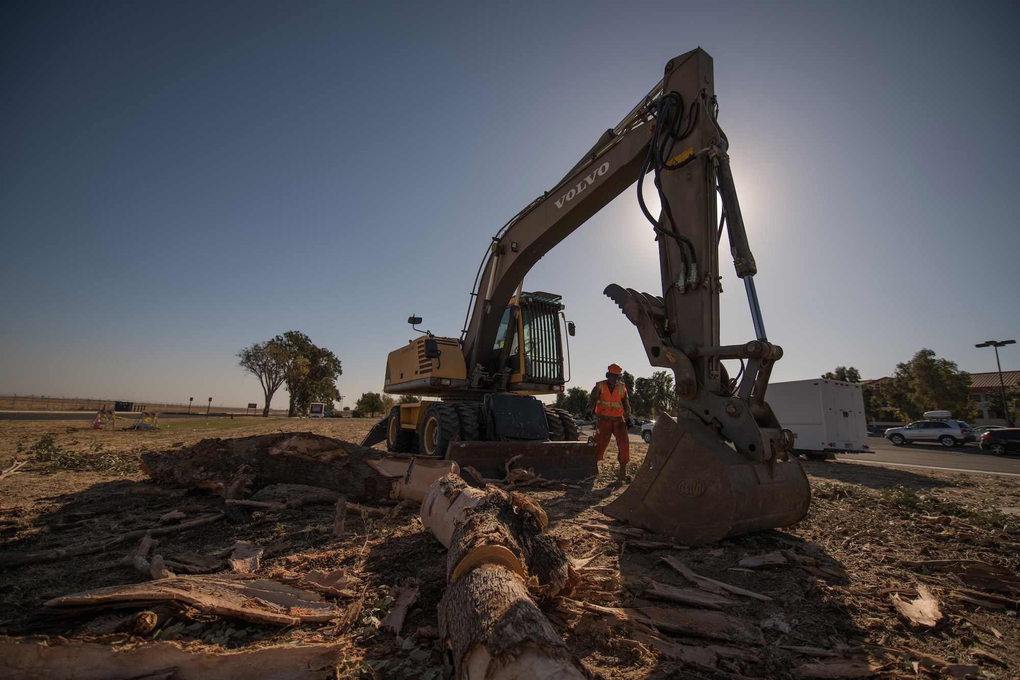 Photos of Travis Airmen cleaning the base of debris.