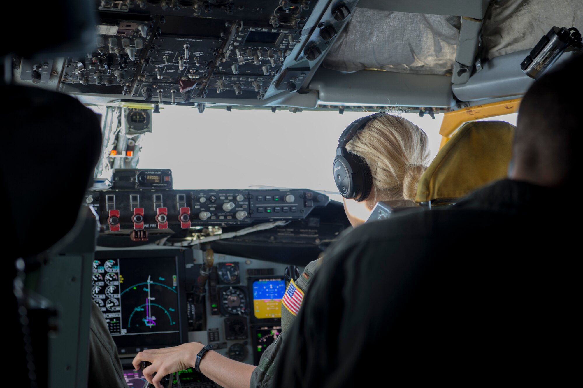 U.S. Air Force 2nd Lt. Michelle Christensen, a 63rd Air Refueling Squadron pilot, operates the controls of a KC-135 Stratotanker during a refueling mission Nov. 4, 2019.  Christensen successfully completed her first flight, while providing air refueling support to the national global strike and strategic deterrence mission.