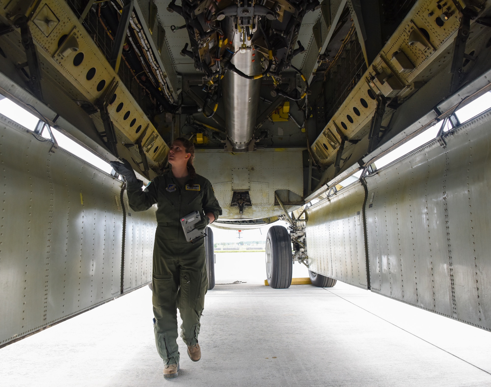Capt. Rachel Long, 69th Expeditionary Bomb Squadron radar navigation officer, performs a pre-flight check in a B-52 Stratofortress’ bomb bay on Andersen Air Force Base, Guam, Oct. 22, 2019. The 69th EBS flies B-52s in support of the Continuous Bomber Presence, a mission that routinely forward deploys aircraft in support of global strike capability and regional security to our allies. (U.S. Air Force photo by Airman 1st Class Michael S. Murphy)