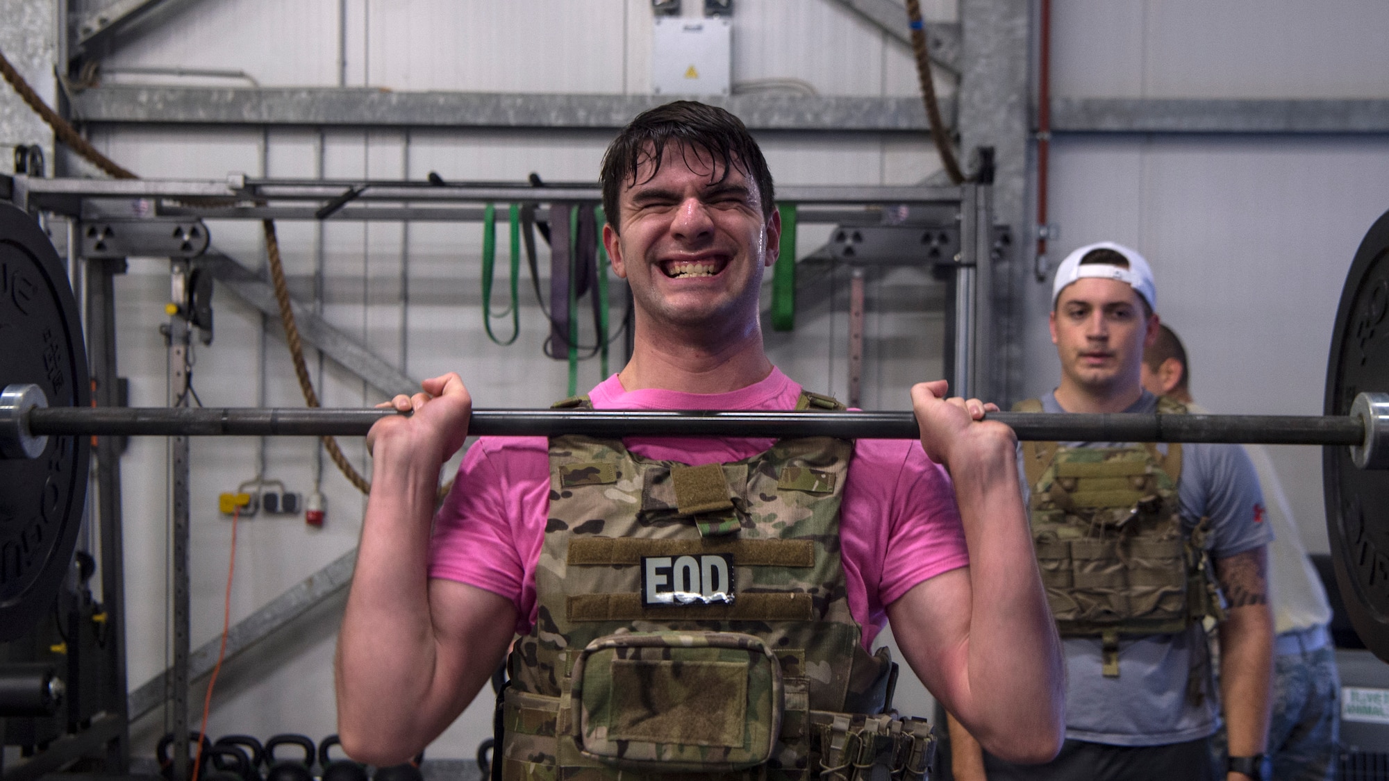 U.S. Air Force Senior Airman Kenaniah Taft, explosive ordnance disposal technician, performs a hang power clean at Ramstein Air Base, Germany, Nov. 5, 2019.