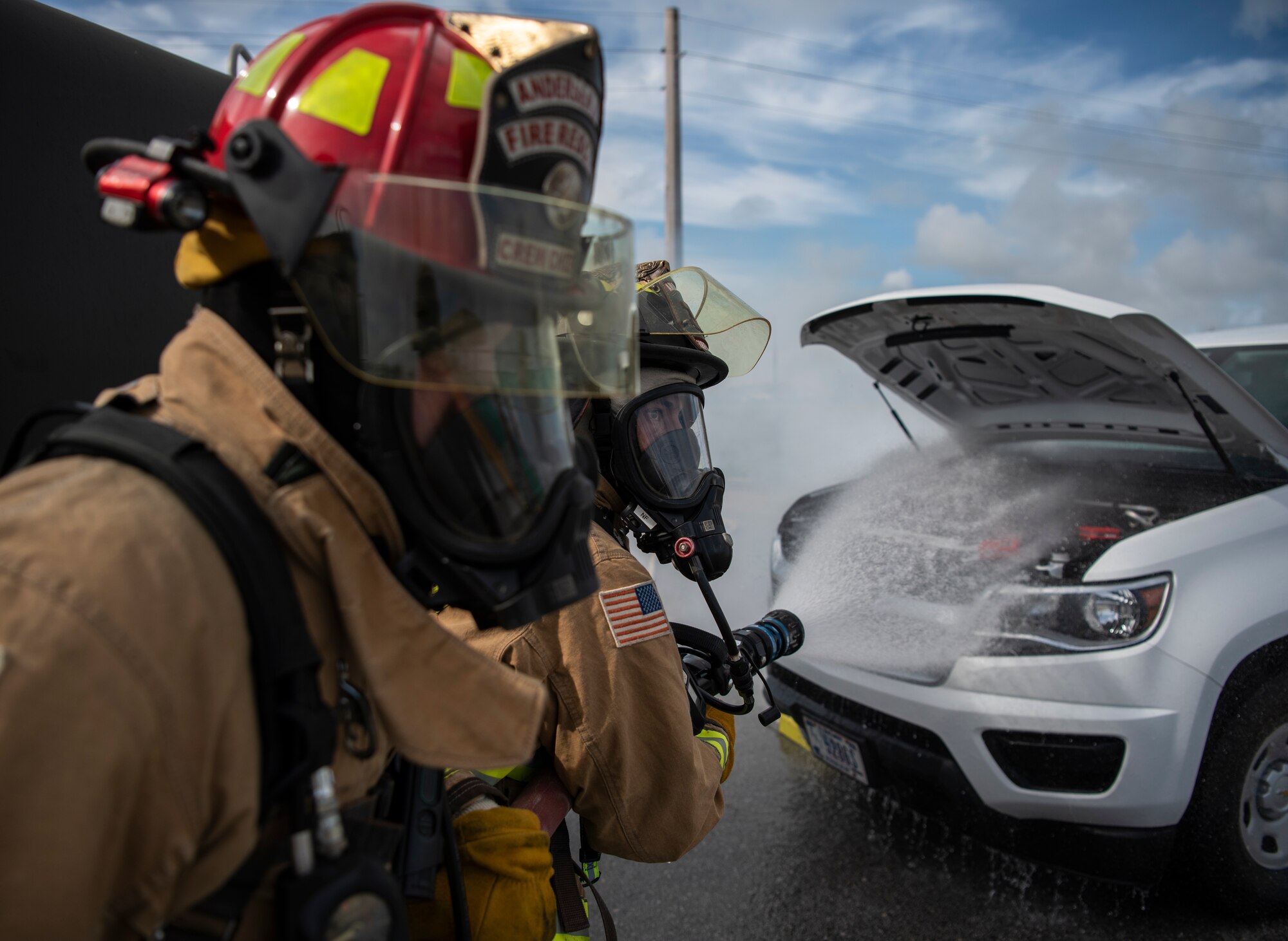 Staff Sgt. Jacob Hester (left), and Senior Airman Luis Leon, 36th Civil Engineer Squadron firefighters, respond to a simulated fire during a fuel spill exercise on Andersen Air Force Base, Guam, Nov. 6, 2019.