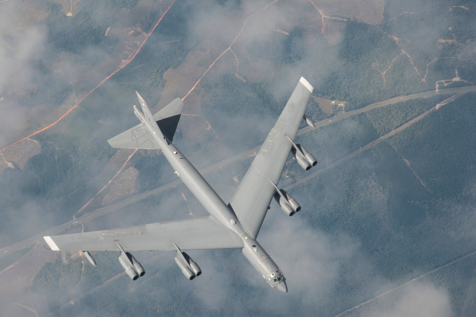 A B-52 Stratofortress from Barksdale Air Force Base, La., descends after receiving fuel from a KC-135 Stratotanker from MacDill AFB, Fla., Nov. 4, 2019.  The KC-135 delivers rapid global mobility and air refueling to extend the capabilities for global strike and strategic deterrence missions.