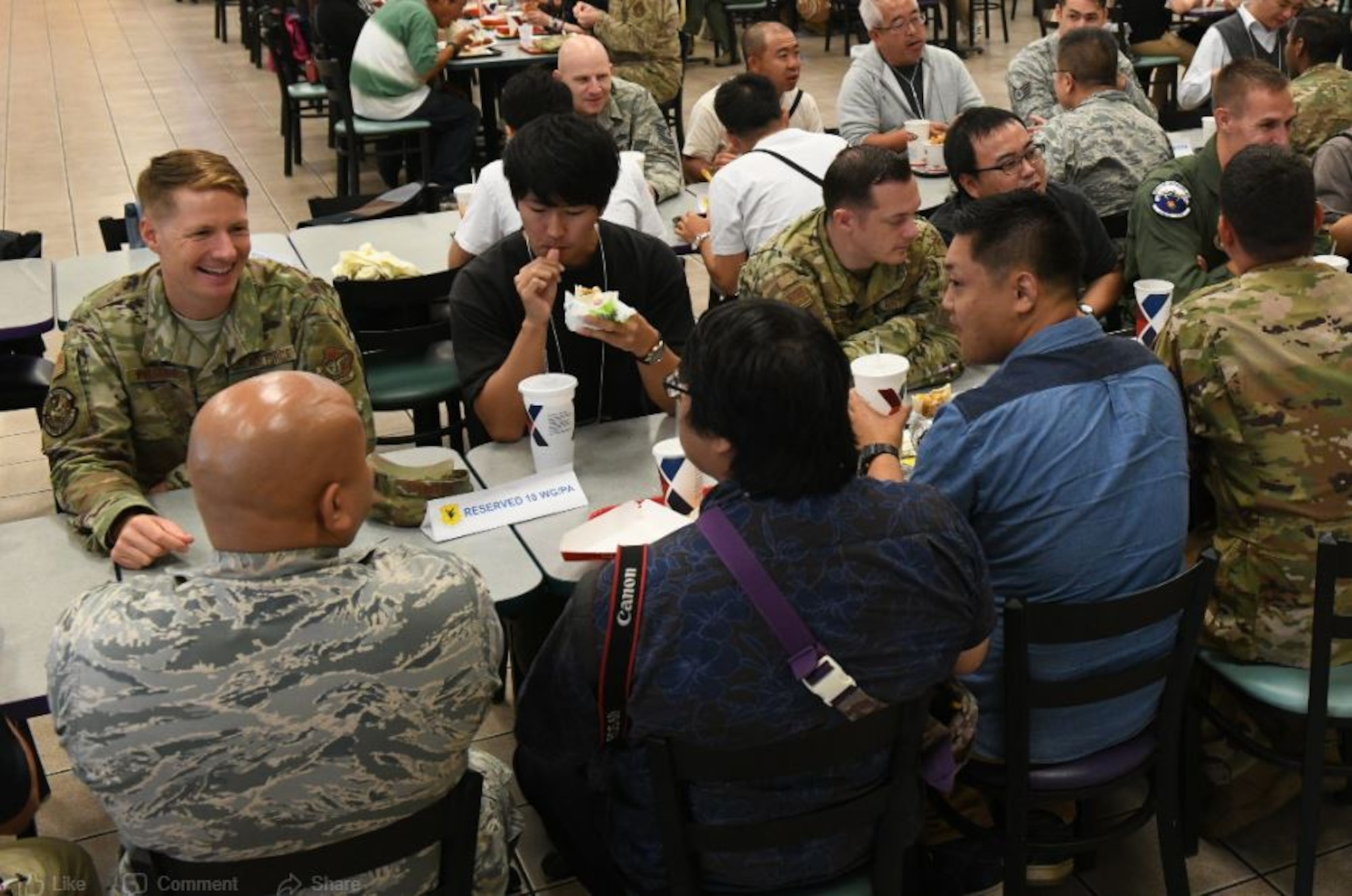 Airmen from the 18th Wing talk and have lunch with Twitter Tour participants at Kadena Air Base, Japan, Nov. 4, 2019. The participants were selected based on when they subscribed to the 18th Wing Twitter page and a brief application process. (U.S. Air Force photo by Staff Sgt. Peter Reft)