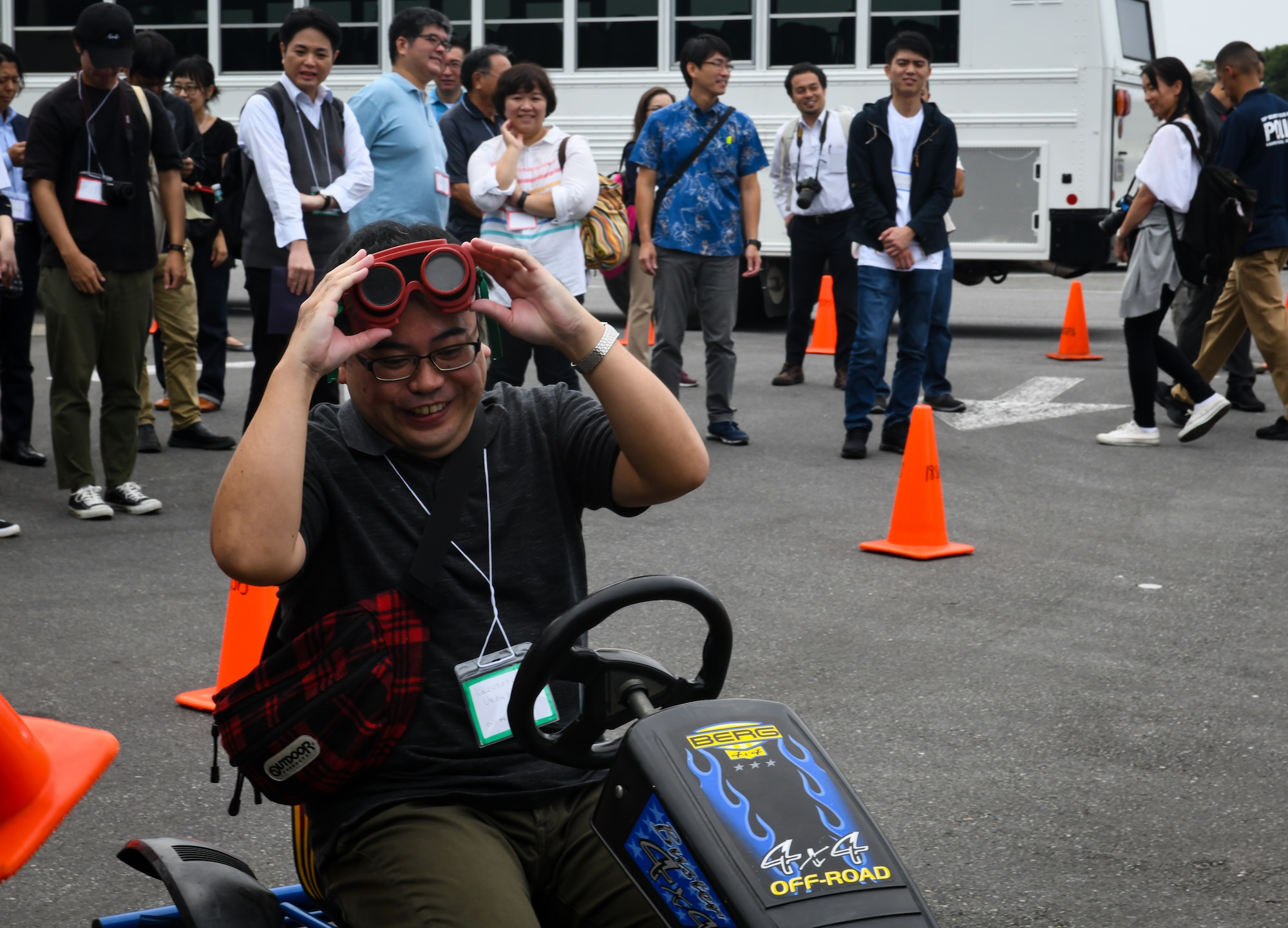 Kazunori Uehara, Twitter Tour visitor, drives a go-cart while wearing drunk goggles during a drunken driving prevention demonstration at Kadena Air Base, Japan, Nov. 4, 2019. Uehara was given drunk goggles to simulate driving under the influence of alcohol. Other demonstrations included using beer and mouthwash to show alcohol's effect on a breathalyzer. (U.S. Air Force photo by Staff Sgt. Benjamin Raughton)