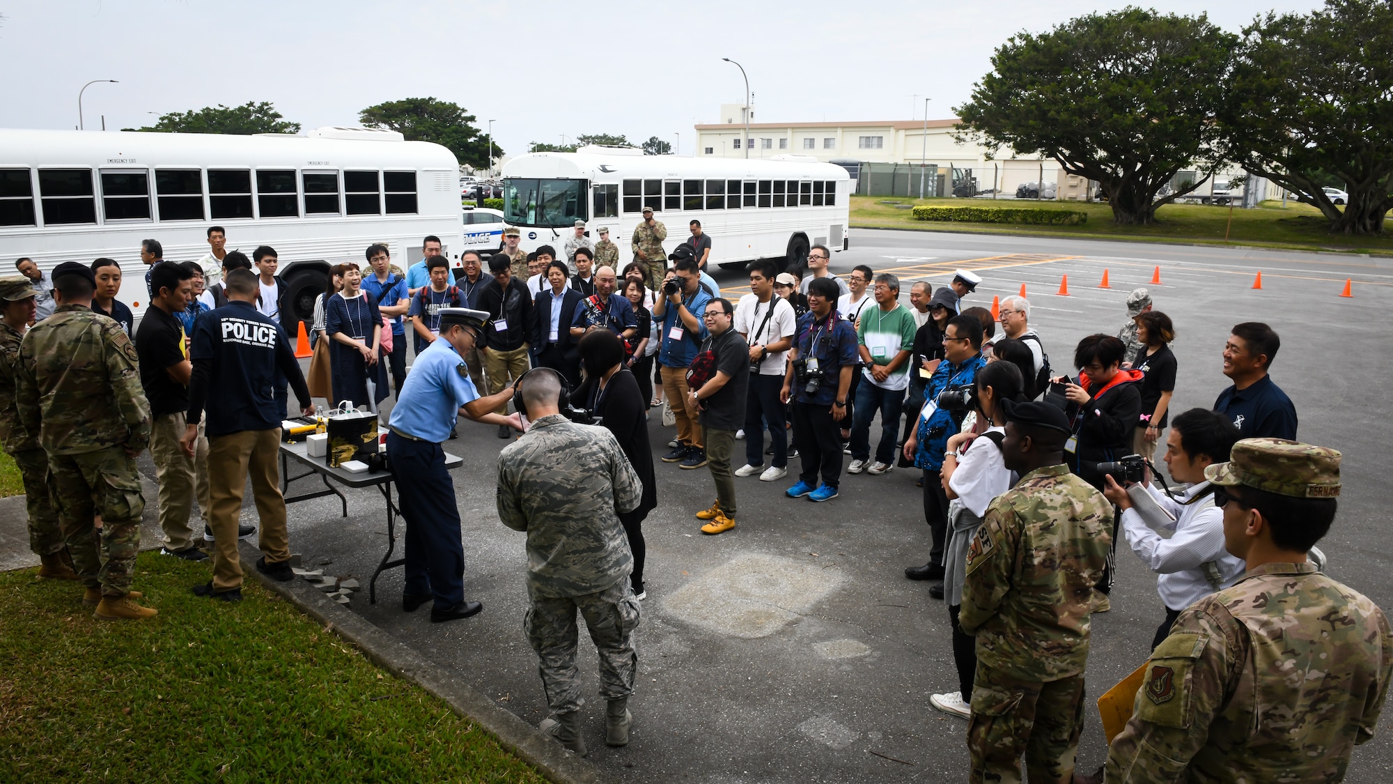 18th Security Forces Squadron defenders and members of Okinawa Prefectural Police perform a demonstration for visitors hosted by 18th Wing Public Affairs during the Twitter Tour at Kadena Air Base, Japan, Nov. 4, 2019. The defenders and local police described how they work together to handle and prevent drunken driving incidents. (U.S. Air Force photo by Staff Sgt. Benjamin Raughton)
