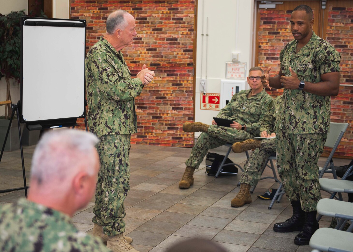 YOKOSUKA, Japan (Nov. 07, 2019) Rear Adm. Brent Scott, Navy Chief of Chaplains, listens to Lt. Leotra West, USS Shiloh (CG 67) chaplain, during a town hall at Commander, Fleet Activities Yokosuka chapel. During his visit, Rear Adm. Scott toured ships moored at Yokosuka, spoke with Sailors and held a town hall to talk about the way forward for the religious ministry community in accordance with the Department of the Navy Strategic Plan for Religious Ministry.