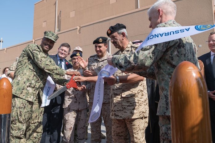 Vice Adm. Jim Malloy, commander of U.S. Naval Forces Central Command, U.S. 5th Fleet and Combined Maritime Forces, right, Rear Adm. Alvin Holsey, commander of Coalition Task Force (CTF) Sentinel and other senior partner military leaders cut a ceremonial ribbon during the CTF Sentinel ribbon-cutting ceremony. CTF Sentinel is a multinational maritime effort to promote maritime stability, ensure safe passage, and enhance freedom of navigation throughout key waterways in the Arabian Gulf, Strait of Hormuz, the Bab el-Mandeb Strait and the Gulf of Oman.