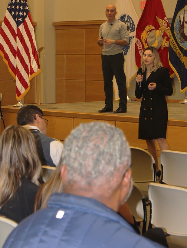 DLA Troop Support Industrial Hardware Technical and Traditional Acquisition Division Chiefs Jose Pereira and Joanne Anello, back left and right, respectively, share the intent the IH cross-functional event held Nov. 5, 2019 in Philadelphia with IH employees.