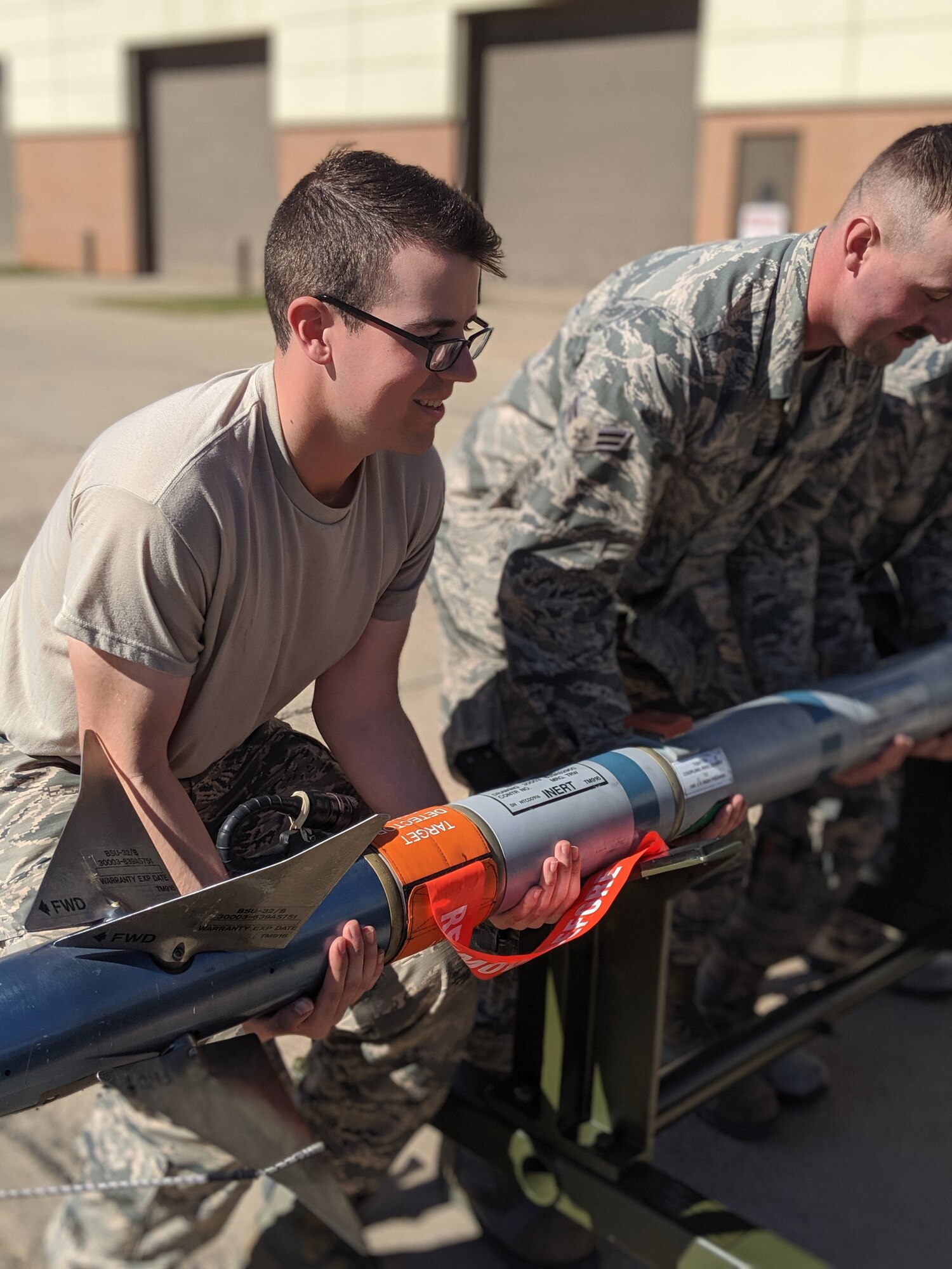 Airman 1st Class Andrew Keller, 363rd Training Squadron munitions systems apprentice course graduate, carries a training bomb at Sheppard Air Force Base, Texas, Nov. 1, 2019. Keller earned the ACE award after scoring perfect scores on all of his block tests during technical training. Keller enjoys learning new skills, making fun stories and bragging rights about what I do. (Courtesy Photo)