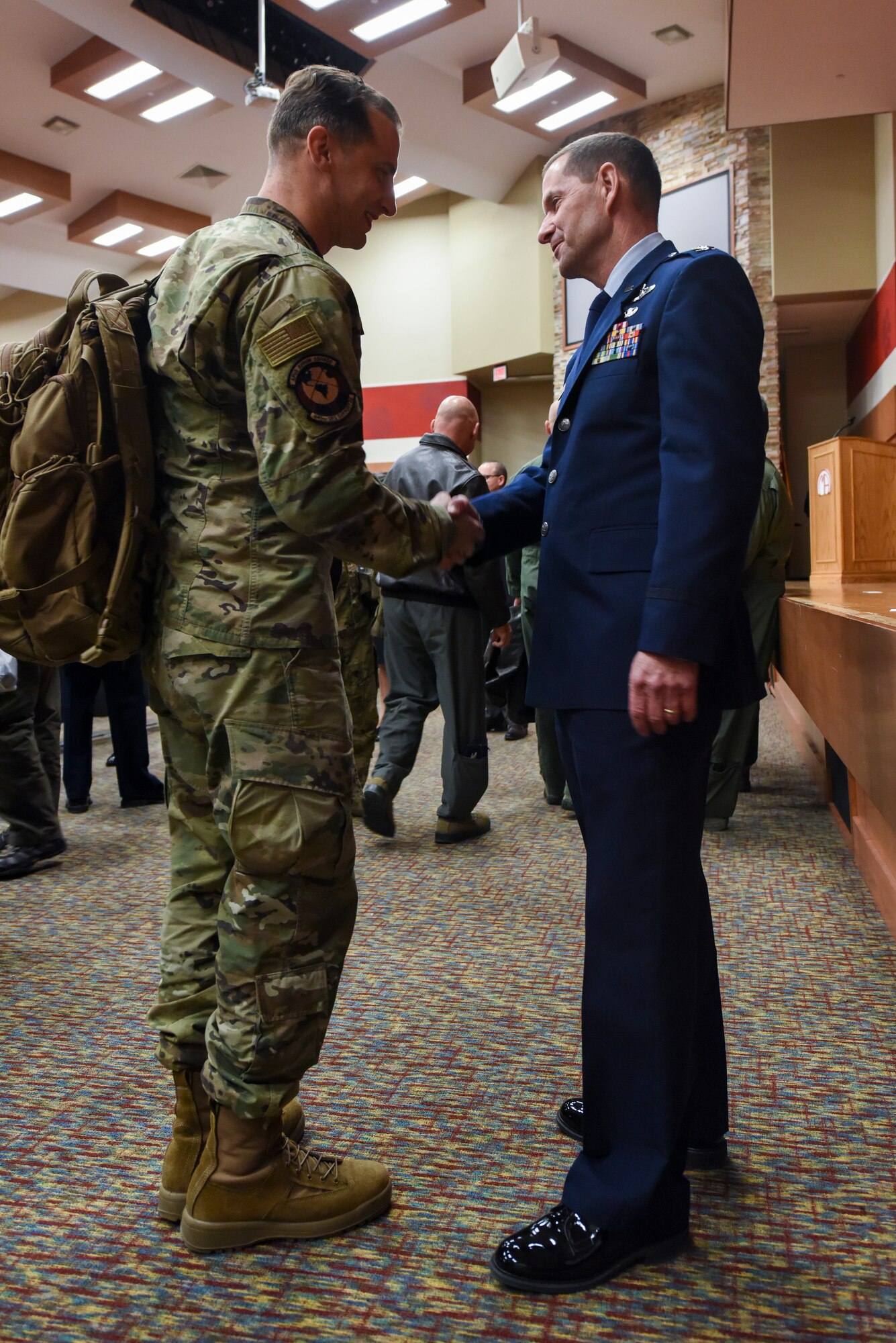 Col. John F. Robinson, 911th Airlift Wing commander, shakes the hand of an Airman of the 445th Operations Group from Wright-Patterson Air Force Base, Ohio, after his assumption of command ceremony in Coraopolis, Pennsylvania, Nov. 2, 2019.