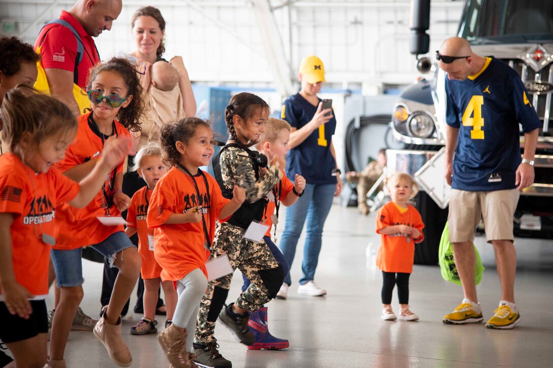 A group of children stomp their feet.