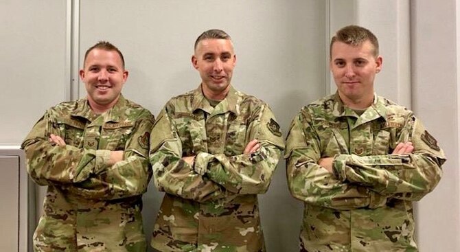 Staff Sgt. David Potter, Tech. Sgt. Andrew Potter, and Staff Sgt. Samuel Potter pose together before departing for deployment.