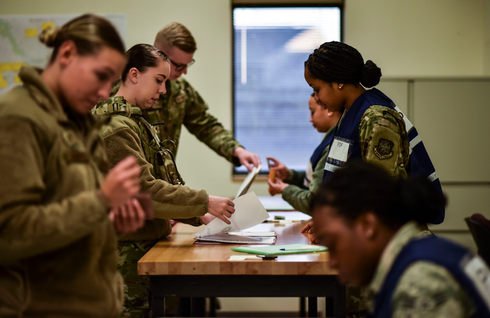 Team Fairchild Airmen go through the Personnel Deployment Function as they simulate a deployment during Exercise Global Thunder at Fairchild Air Force Base, Washington, Oct. 23, 2019. Global Thunder is a U.S. Strategic Command exercise designed to ensure an efficient mission response by testing Airmen’s ability to execute command, control and operational procedures during simulated combat scenarios. (U.S. Air Force photo by Staff Sgt. Dustin Mullen)