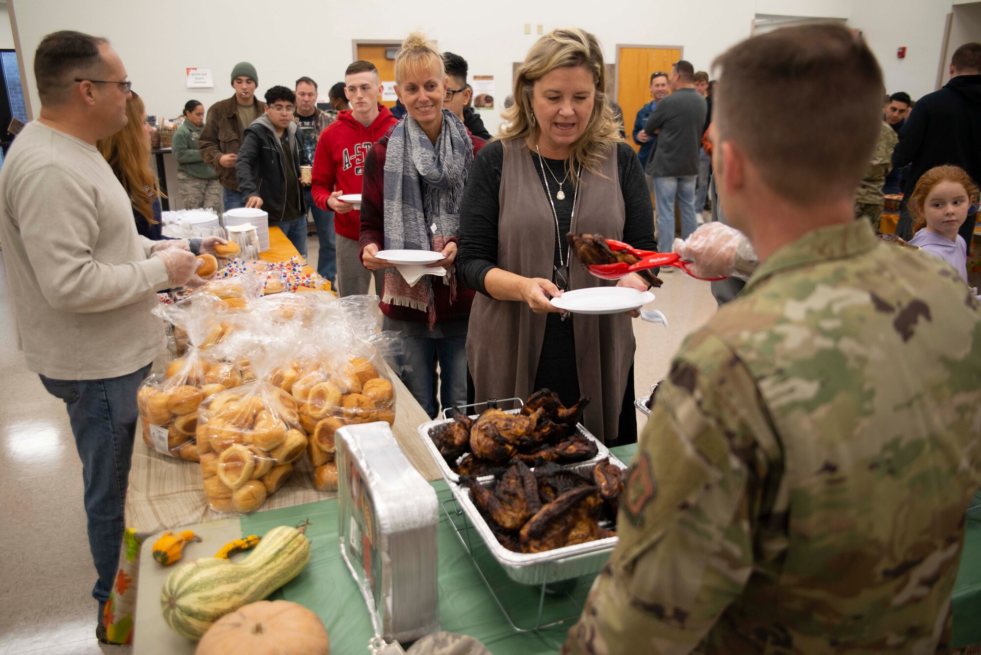 Various 913th Airlift Group leadership serve food during the family day event on Nov. 2, 2019, at Little Rock Air Force Base, Ark. The 913th Airlift Group hosted the event, to help forge a sense of community and support for those members who do not live near the base. Nearly 80 percent of the unit are traditional reservists who live across the state and train one weekend a month, two-weeks a year. (U.S. Air Force Reserve photo by Senior Airman Chase Cannon)