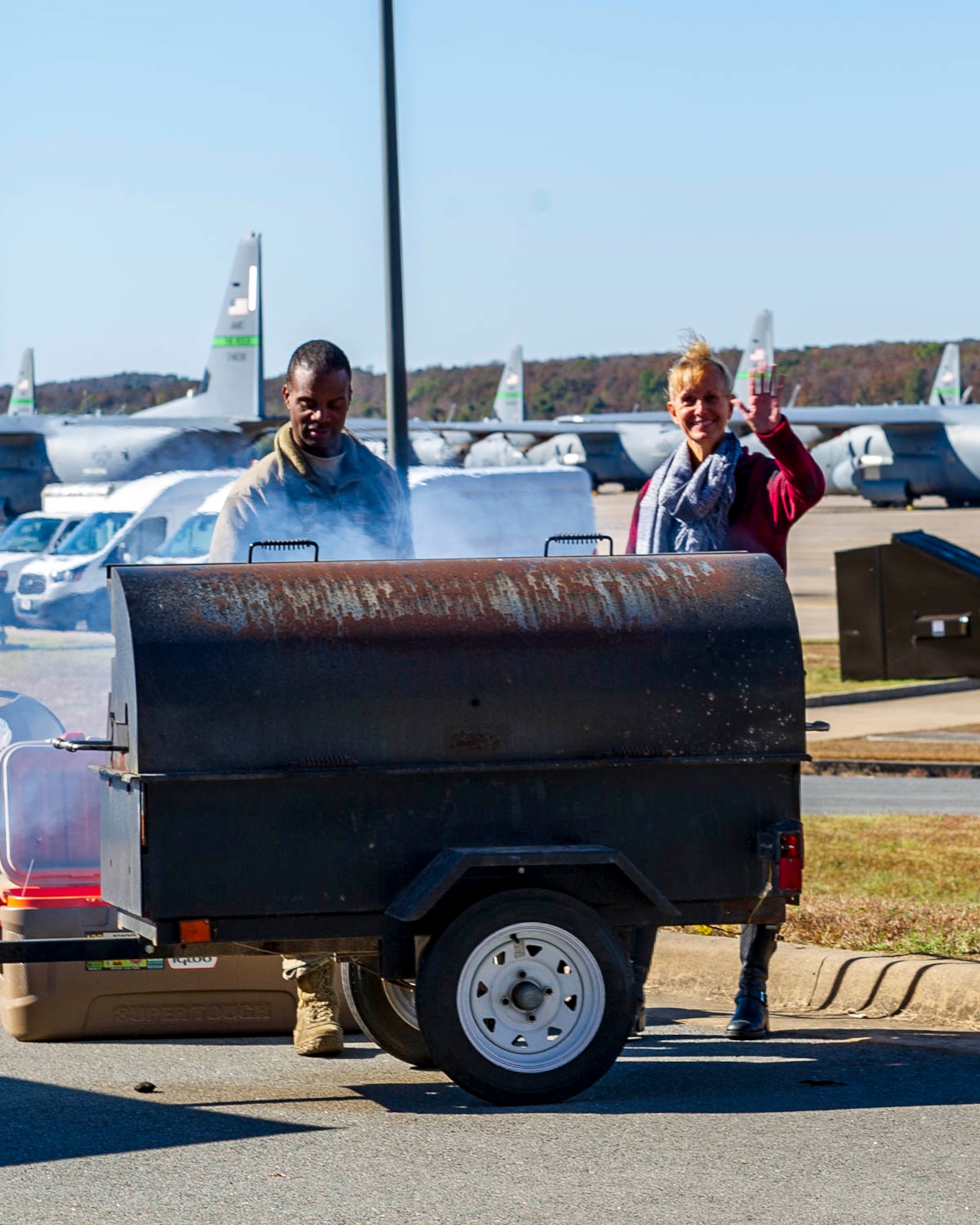 Tech. Sgt. Caleb Black (left), 913th Maintenance Squadron, and Chief Master Sgt. Kimberly Lord (right), 913th Airlift Group Superintendent, cook hamburgers and hot dogs on Nov. 2, 2019, at Little Rock Air Force Base, Ark. The 913th Airlift Group hosted the event, celebrating and showing appreciation for family members' support of their Airmen. (U.S. Air Force Reserve photo by Maj. Ashley Walker)